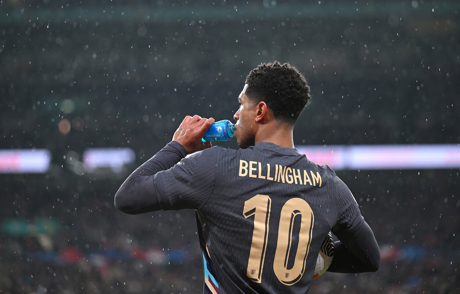 Image showing Bellingham posing with the official England FA font on his back