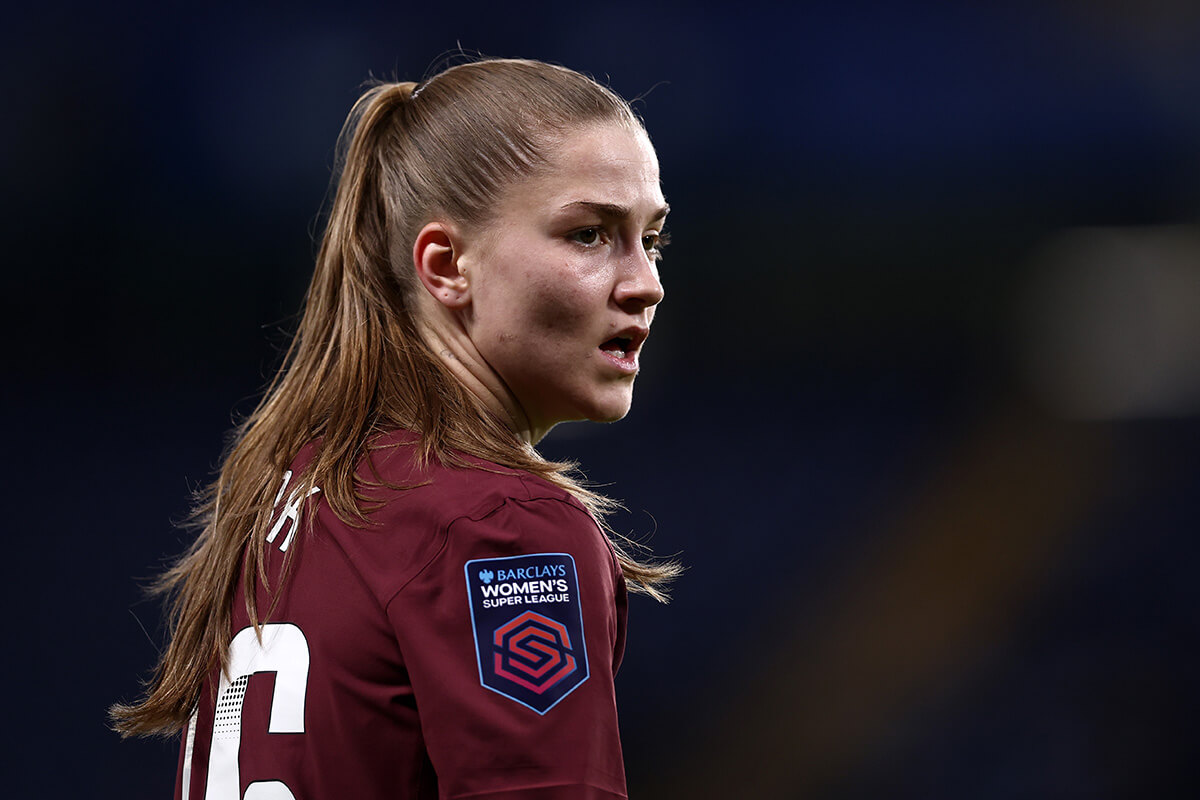 Image showing a player posing wearing the Women's Super League badge