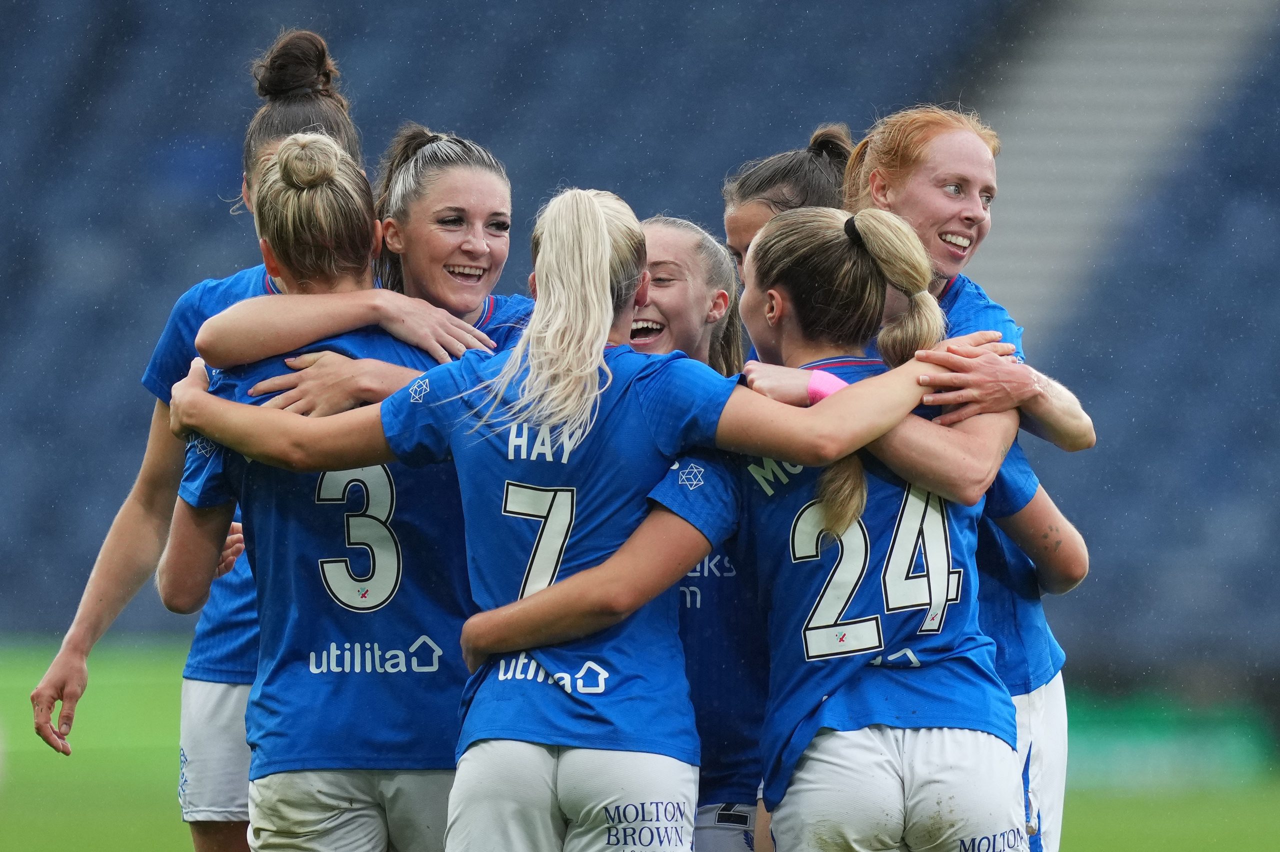 Rachel McLauchlan of Rangers celebrates scoring with her team mates during the Women's Scottish Cup Final wearing the official SWPL font