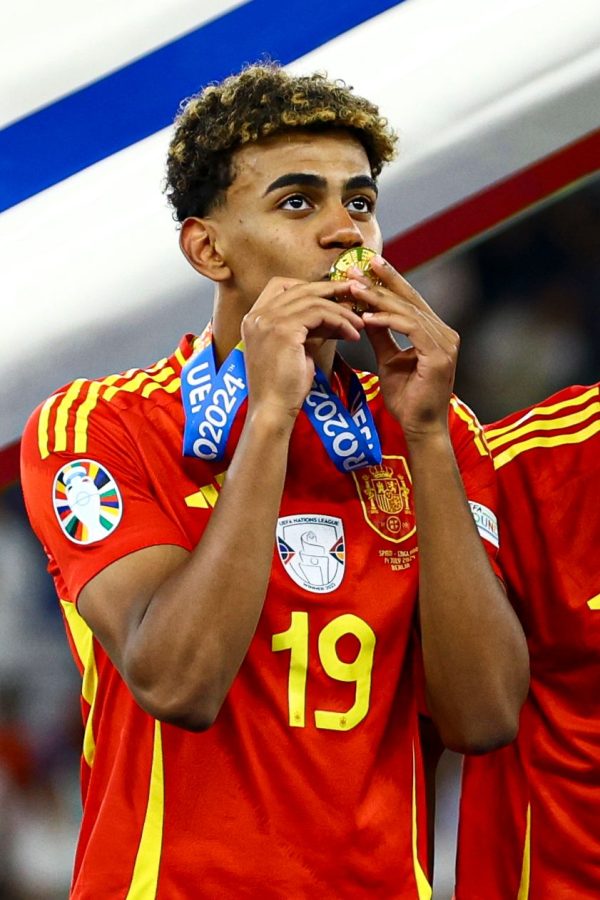 Lamine Yamal of Spain kisses their winners' medal Spain v England, UEFA European Championship 2024,