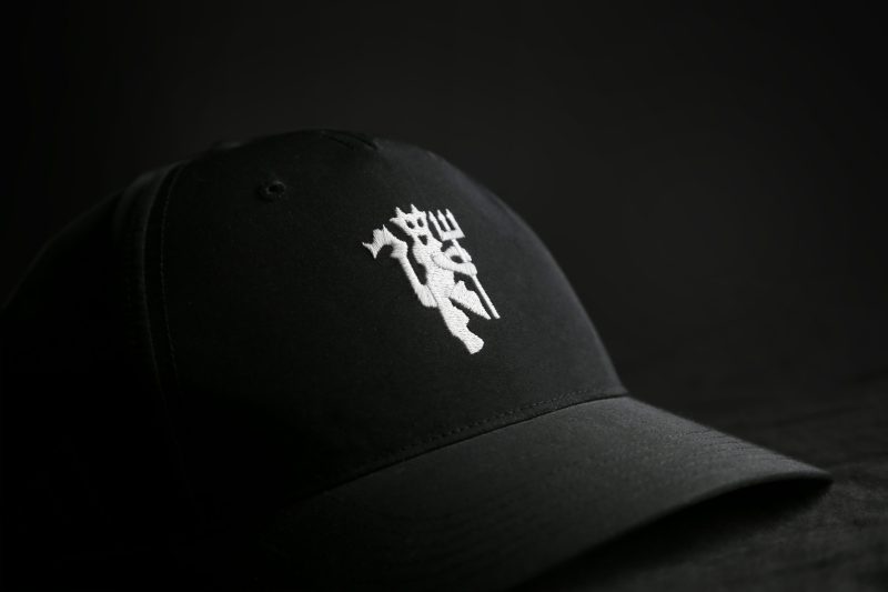 Image showing a Man Utd cap in black with an embroidered Red Devil in white