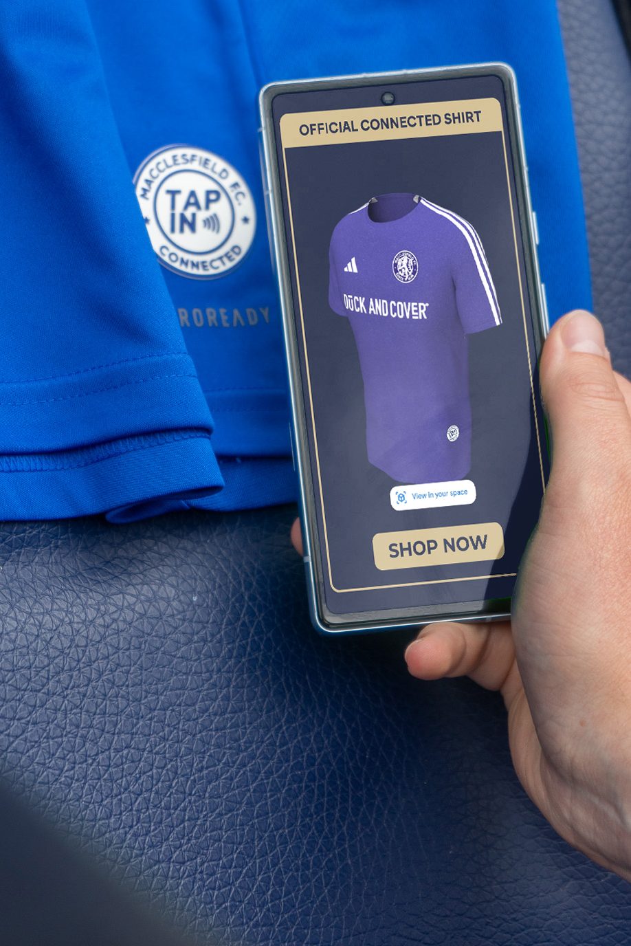 Image showing the Tap In badge on a Macclesfield FC shirt